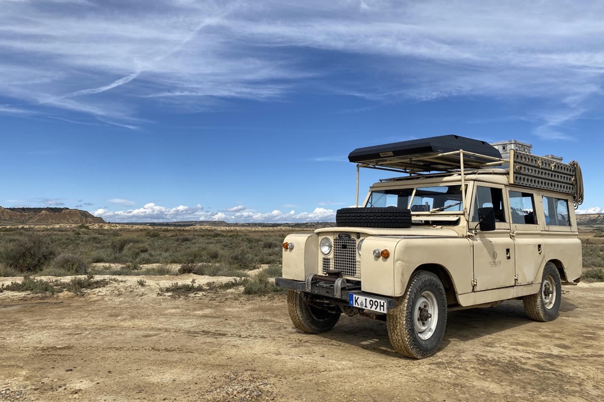 OverlandEurope’s 1963 Land Rover Series II in an open landscape during a journey.
