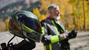 klim hi-vis promtion shot with man wearing hi-vis jacket in front of autumnal background