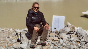 Kate Leeming sitting at the true source of the