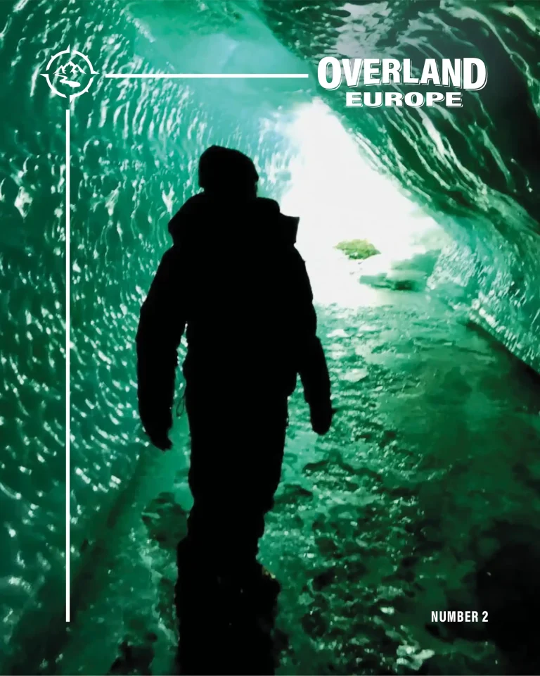 Number 2 cover silhouette of a person standing inside a glacier tunnel