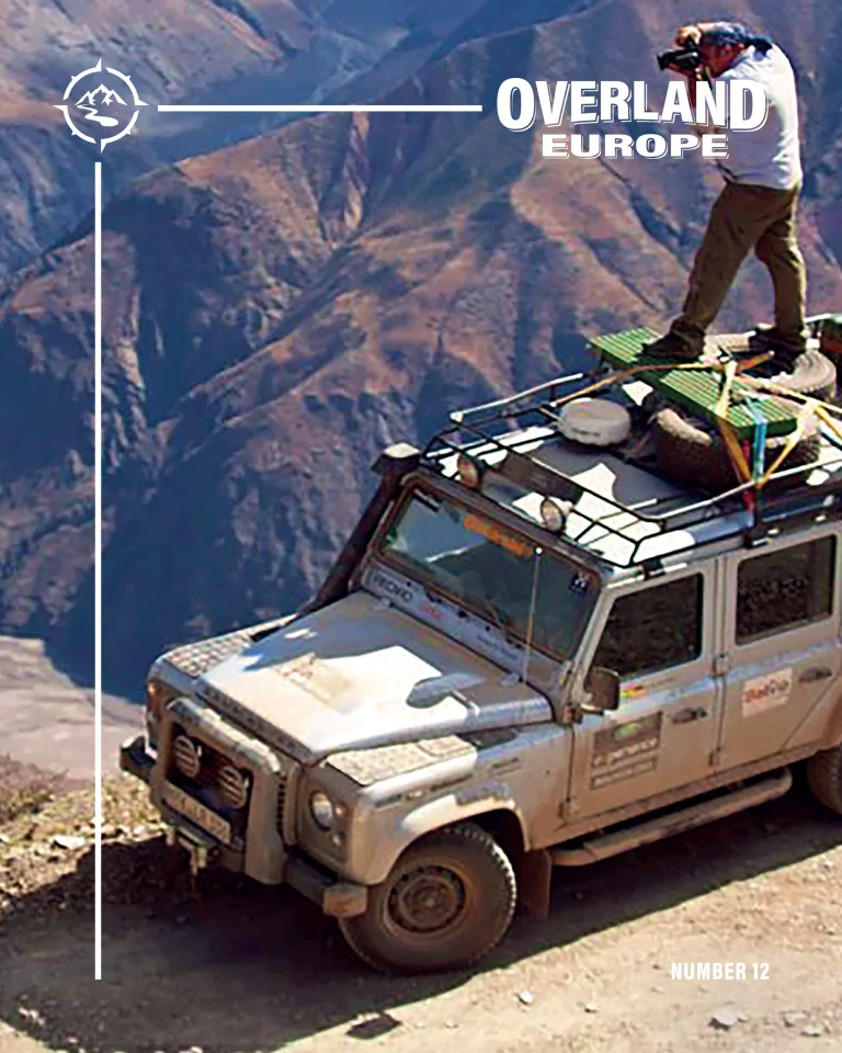 number 12 front cover photographer standing on Land Rover roof
