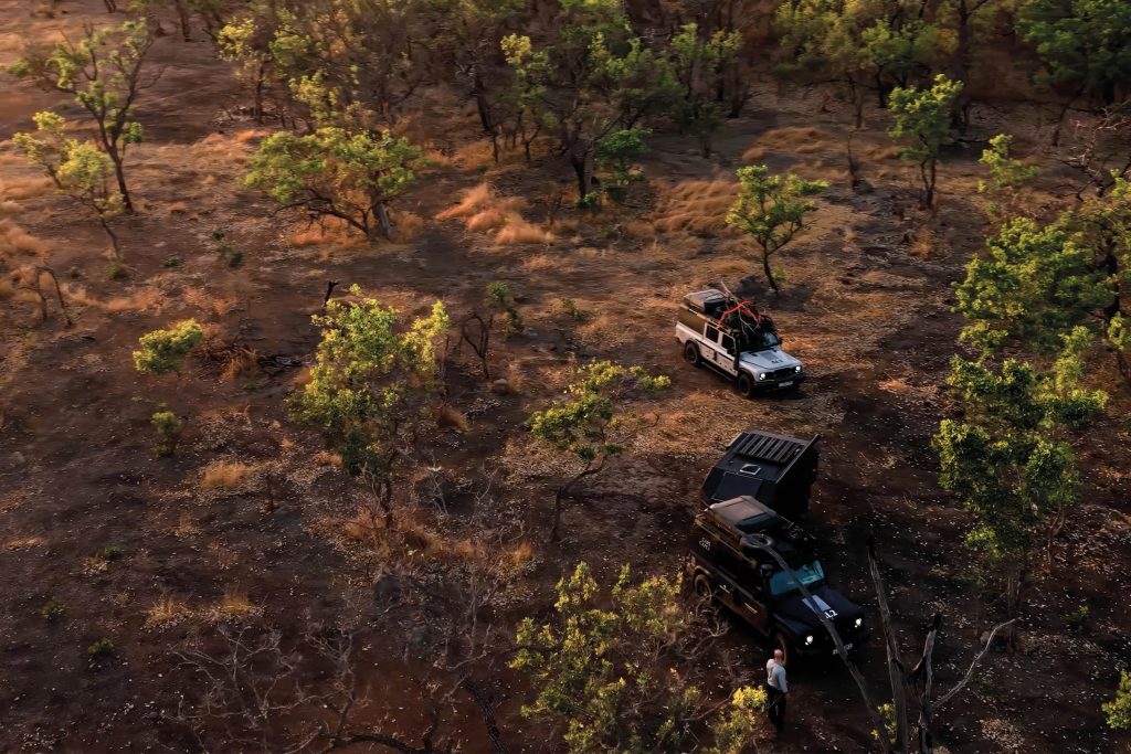 Two INEOS Grenadiers crossing a remote African landscape during John Balsdon’s record-breaking Cape-to-Cape expedition.