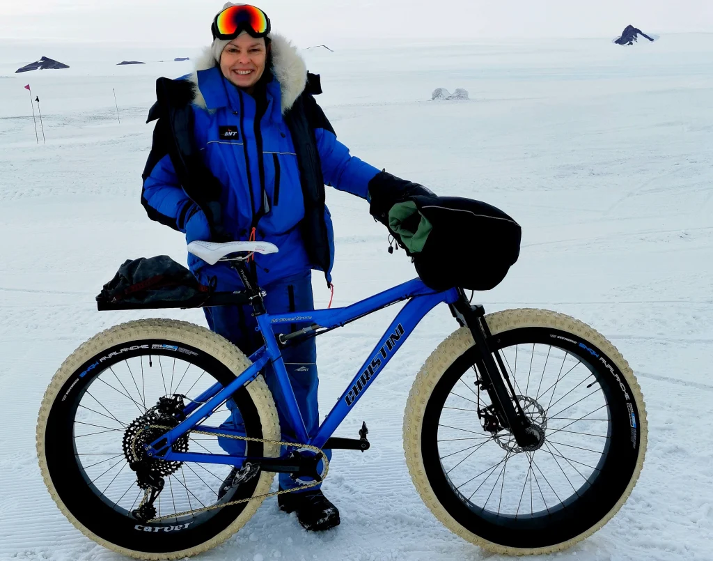 Kate Leeming with the all-wheel-drive fat bike used during the 2023 Breaking the Cycle Antarctica expedition in Queen Maud Land. The journey provided the first opportunity to test the bicycle and its systems under genuine Antarctic conditions.