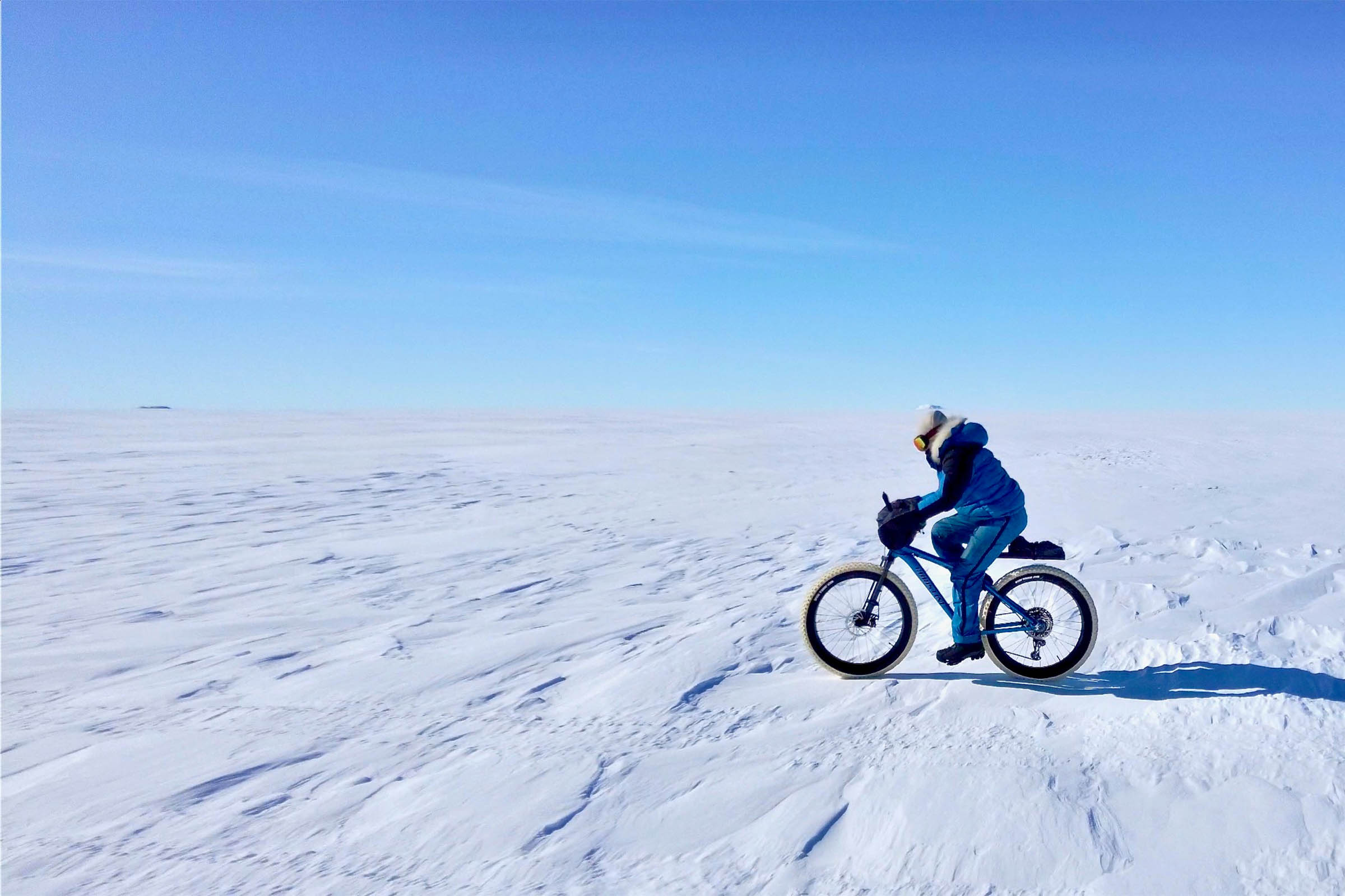 Kate Leeming riding on her bicycle across Queen Maud Land, Antarctica